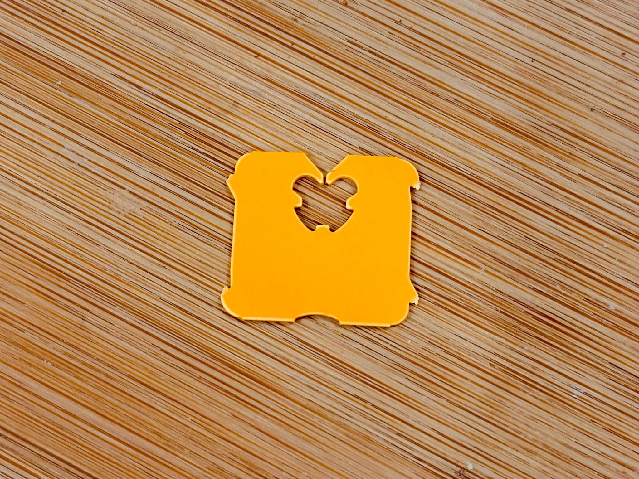 Orange bread tag on a wood grain background