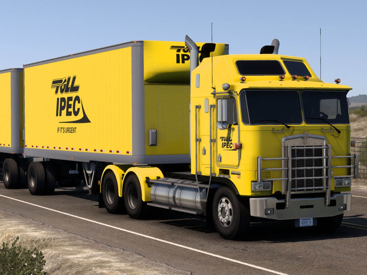 Yellow Toll IPEC branded truck with box trailers