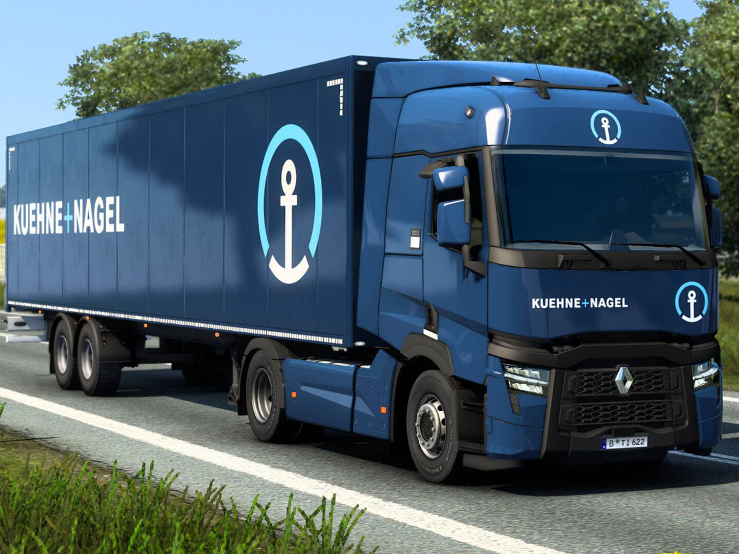 Dark blue Kuehne + Nagel branded truck with trailer
